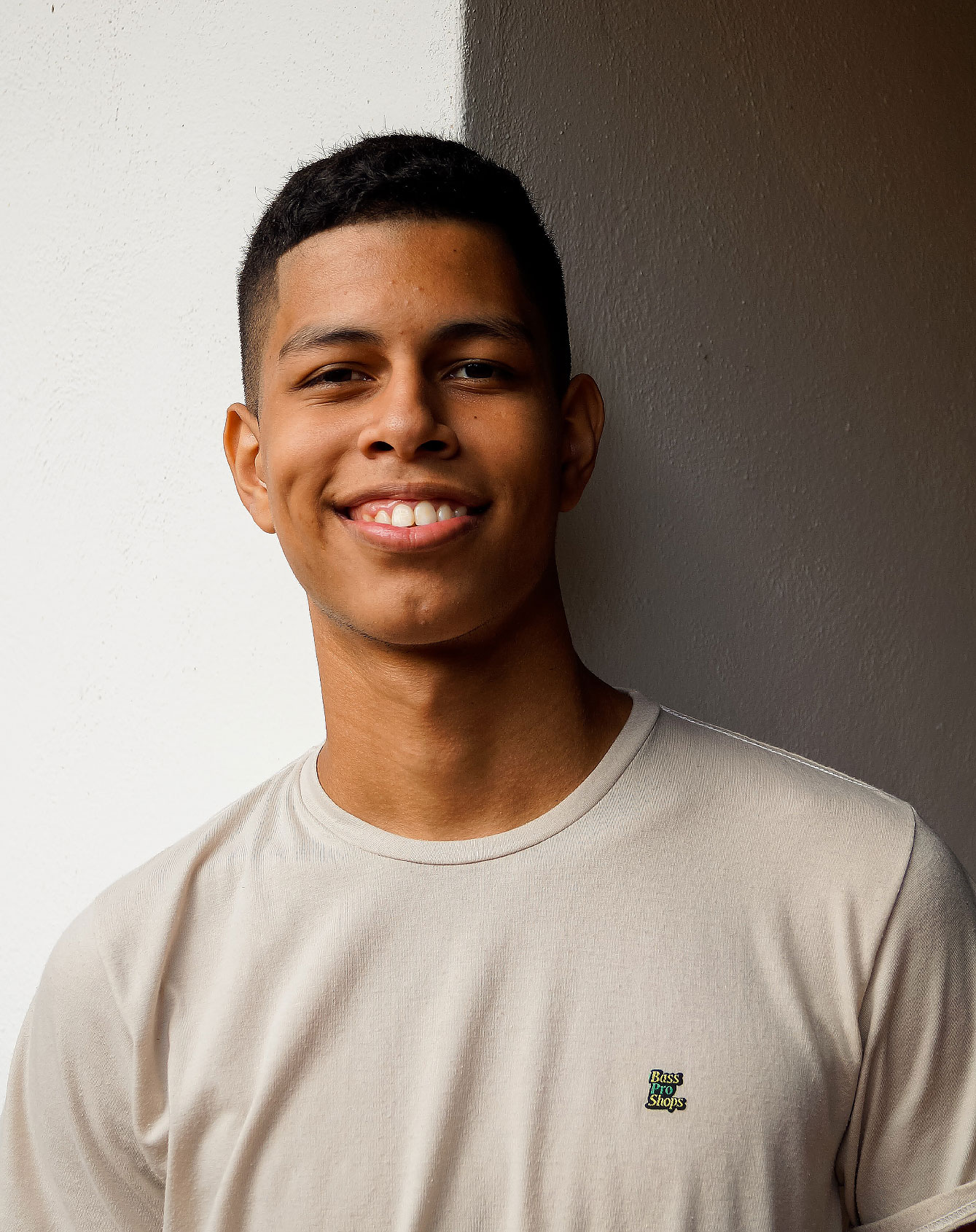 Teenage boy smiling at camera.